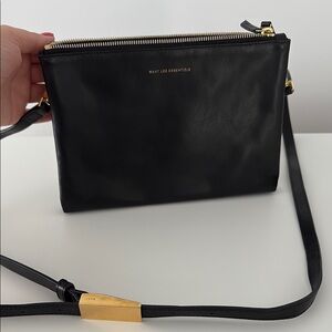 WANT Les Essentiels Black and Gold Crossbody Bag